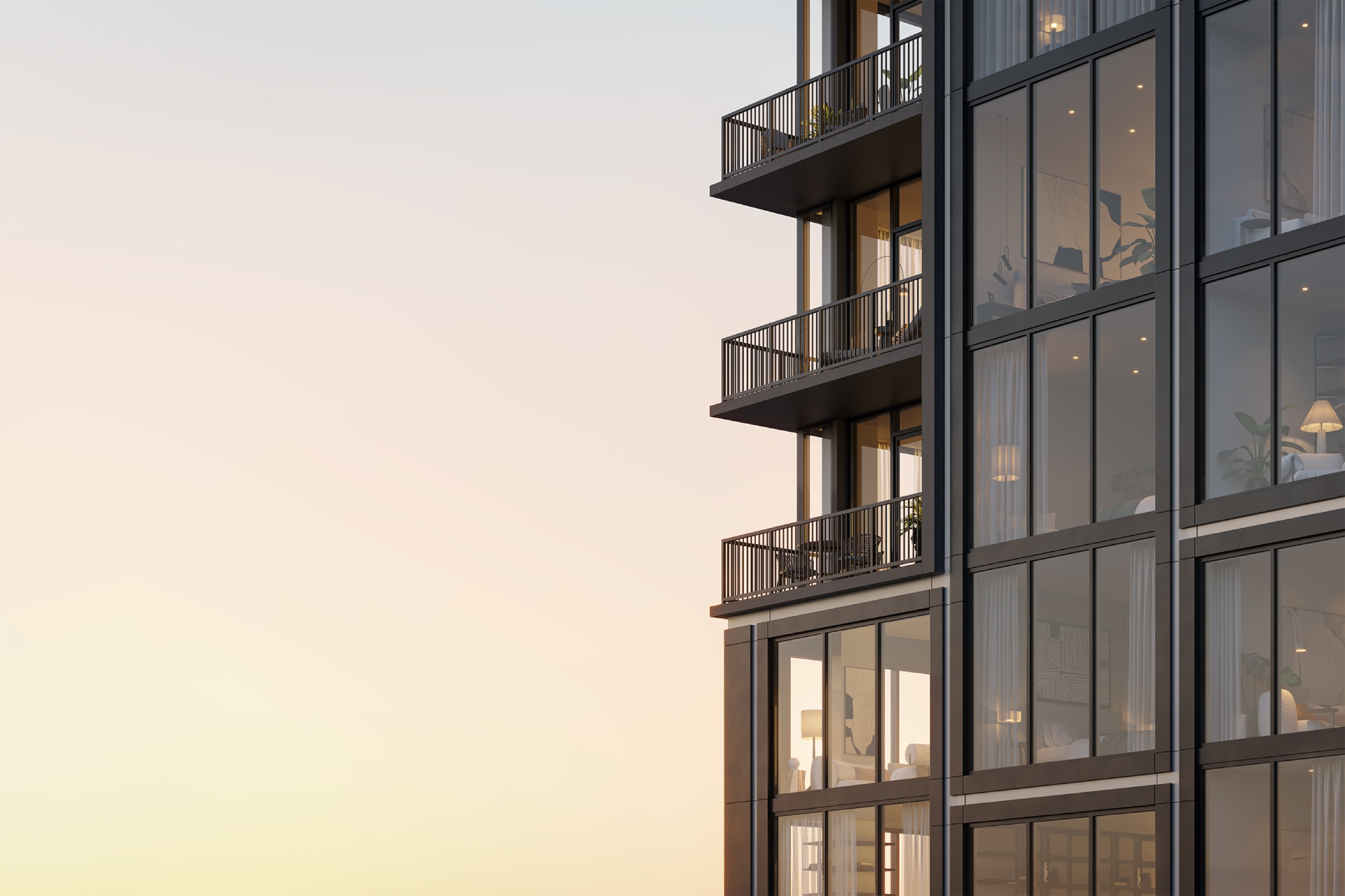 Emmi Midtown luxury apartments' large glass windows & balconies in Atlanta, GA, overlooking the urban landscape.